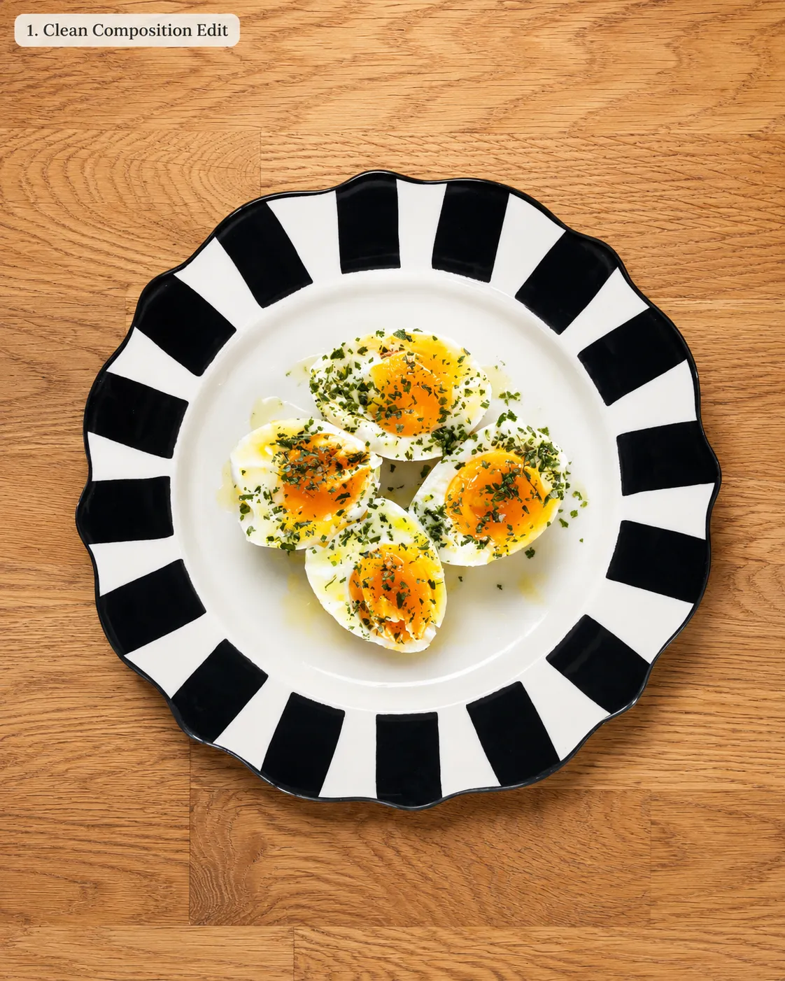 Four soft-boiled egg halves on a black-and-white striped plate, finished with parsley, lemon zest and flaky salt