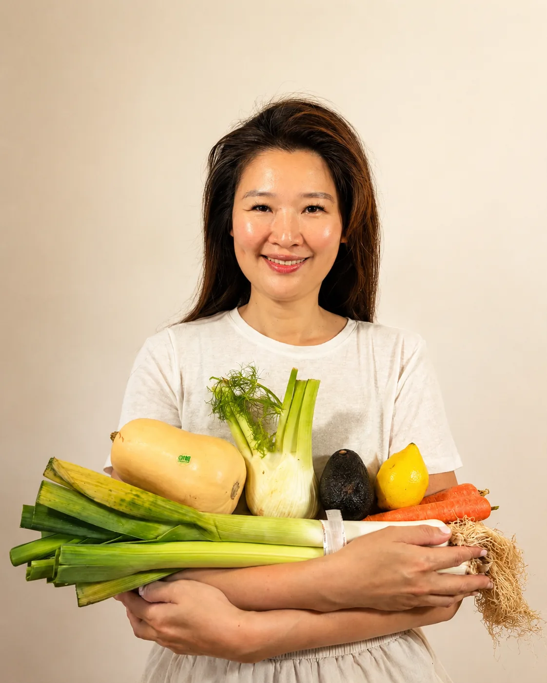 Jasmine Von holding squash, fennel, avocado and carrots