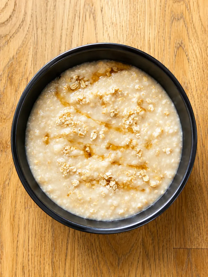A bowl of steel-cut oat porridge with mung beans